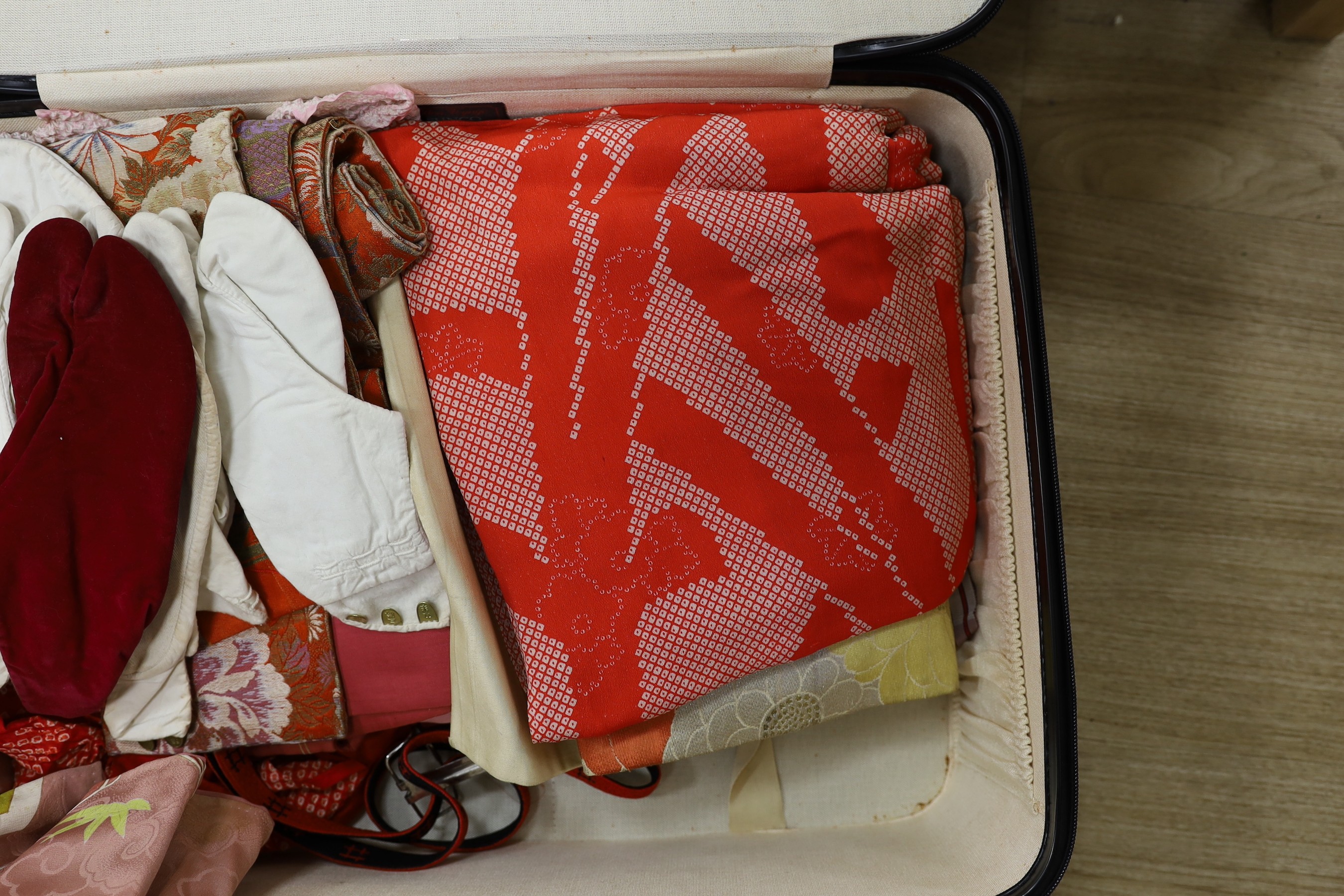 A quantity of Japanese clothing, kimonos, shoes etc